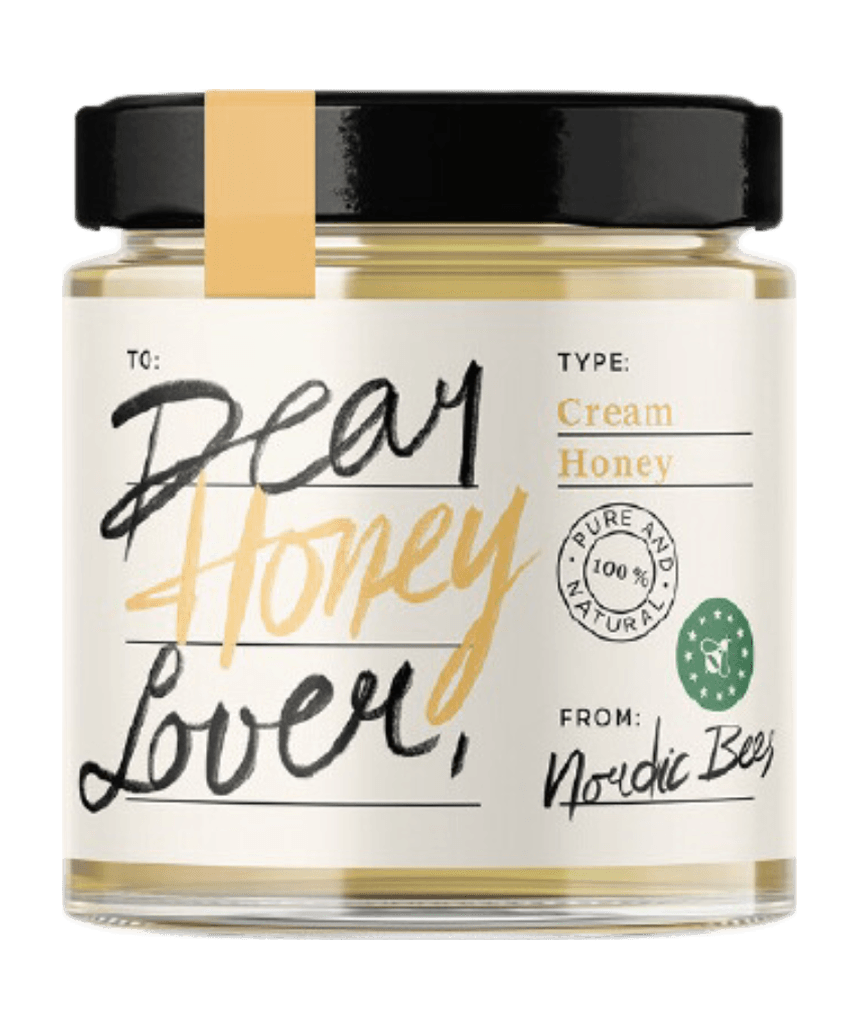 Jar of Dear Honey Lover cream honey from Nordic Bees with a yellow cap stripe